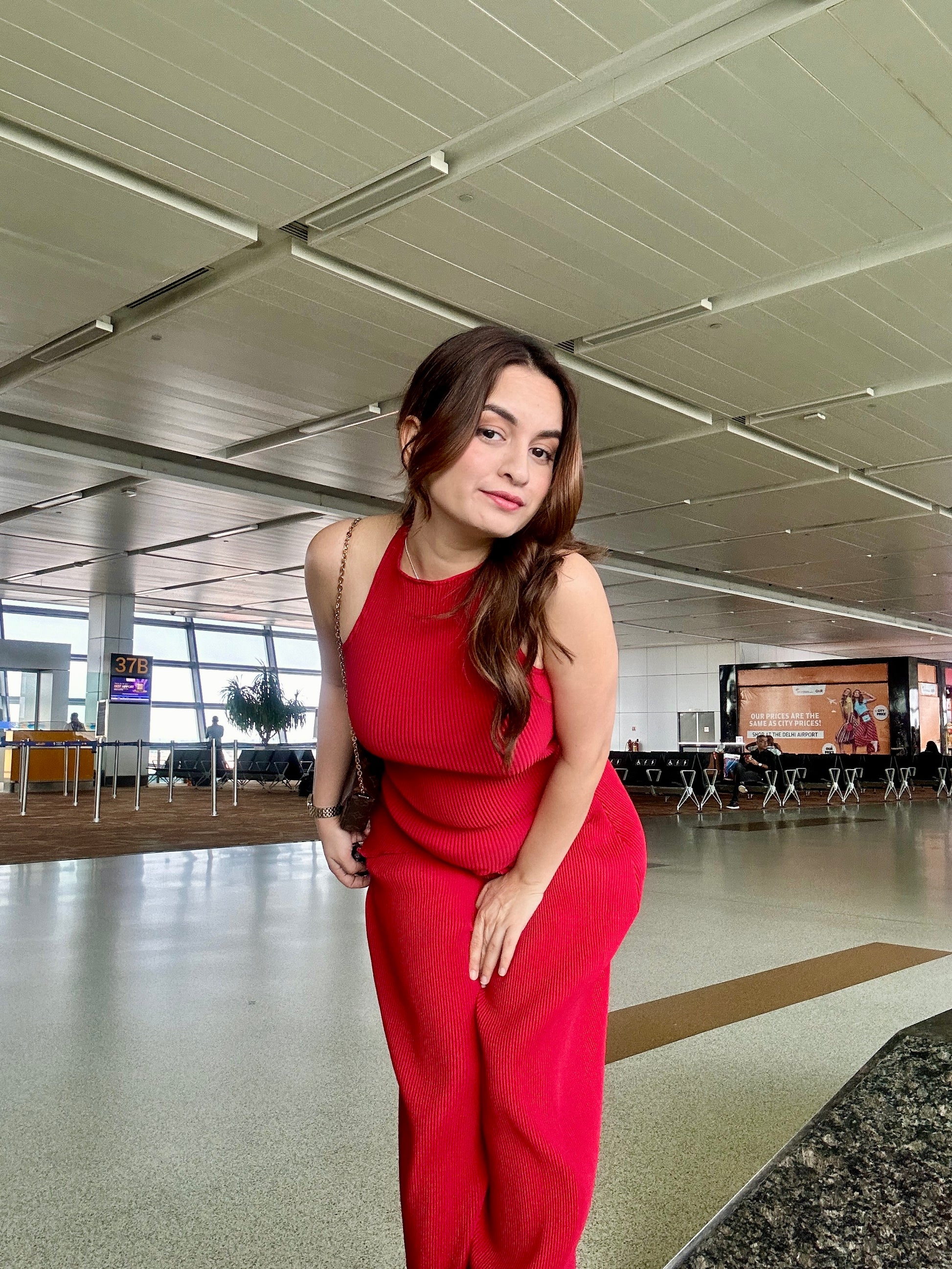 Crinkled cherry red co-ord set by Imagine By Shiwali showing the textured top and matching pants on a model.