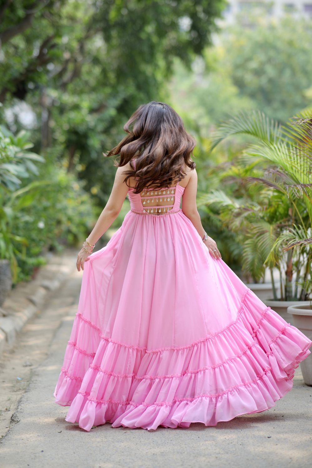 Pink Diya Gown by Imagine By Shiwali, showcasing intricate embroidery and flowing fabric in a stylish, elegant design.