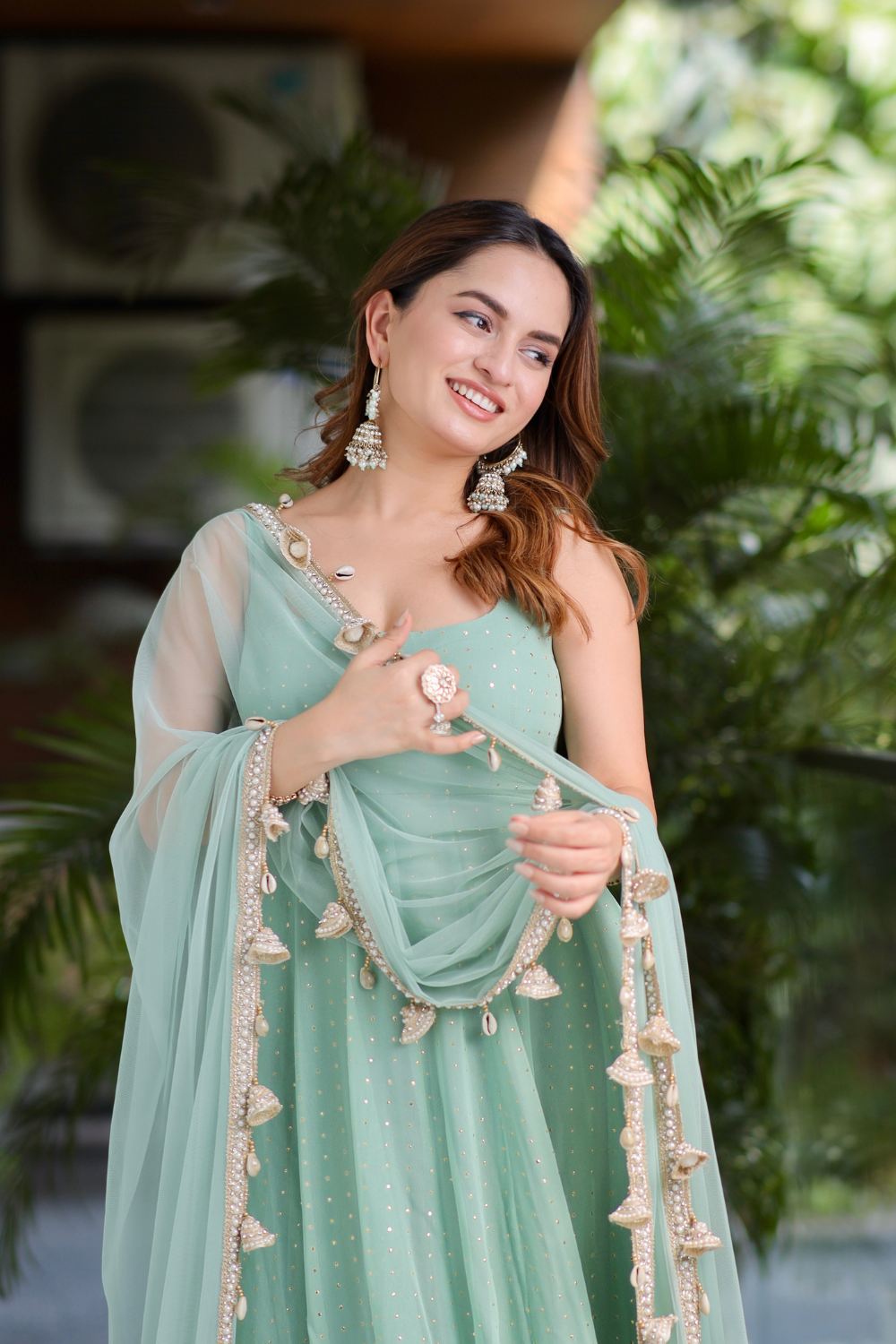 Mint green Dolly Anarkali dress by Imagine By Shiwali featuring intricate embroidery and flowing fabric.