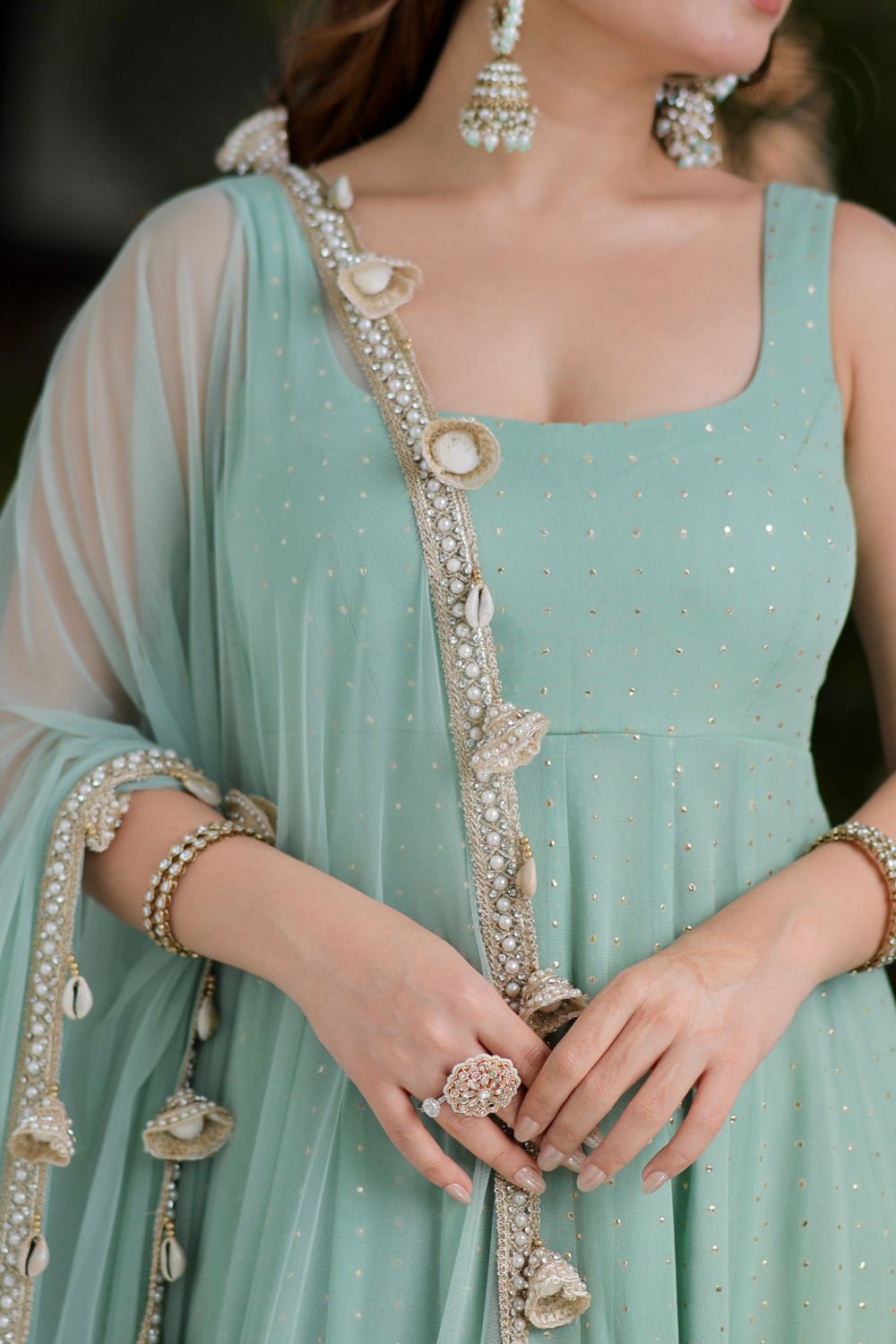 Mint green Dolly Anarkali dress by Imagine by Shiwali with intricate embroidery and flowing fabric displayed on a mannequin.