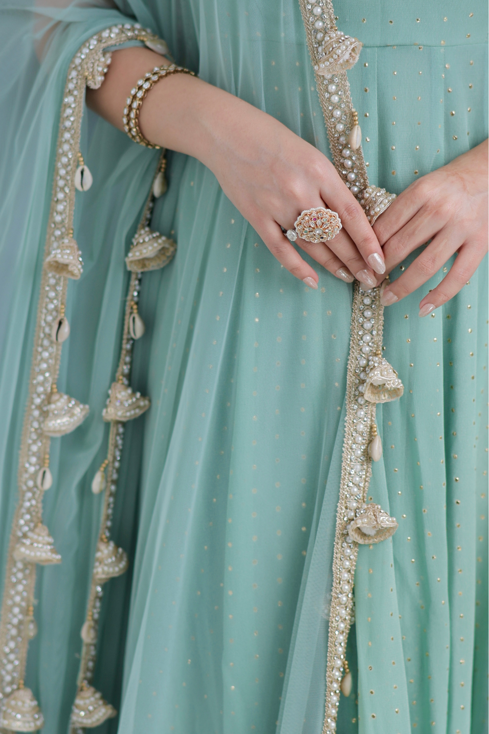 Mint green Dolly Anarkali dress by Imagine by Shiwali featuring intricate embroidery and flowing fabric.