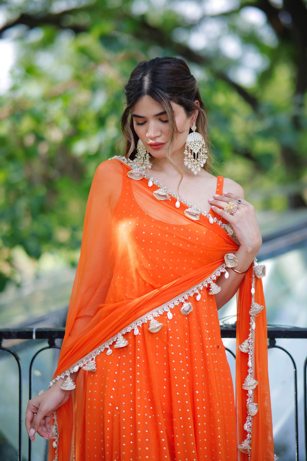 Dolly Orange Anarkali Suit by Imagine By Shiwali featuring intricate embroidery and flowing fabric, styled for festive occasions.