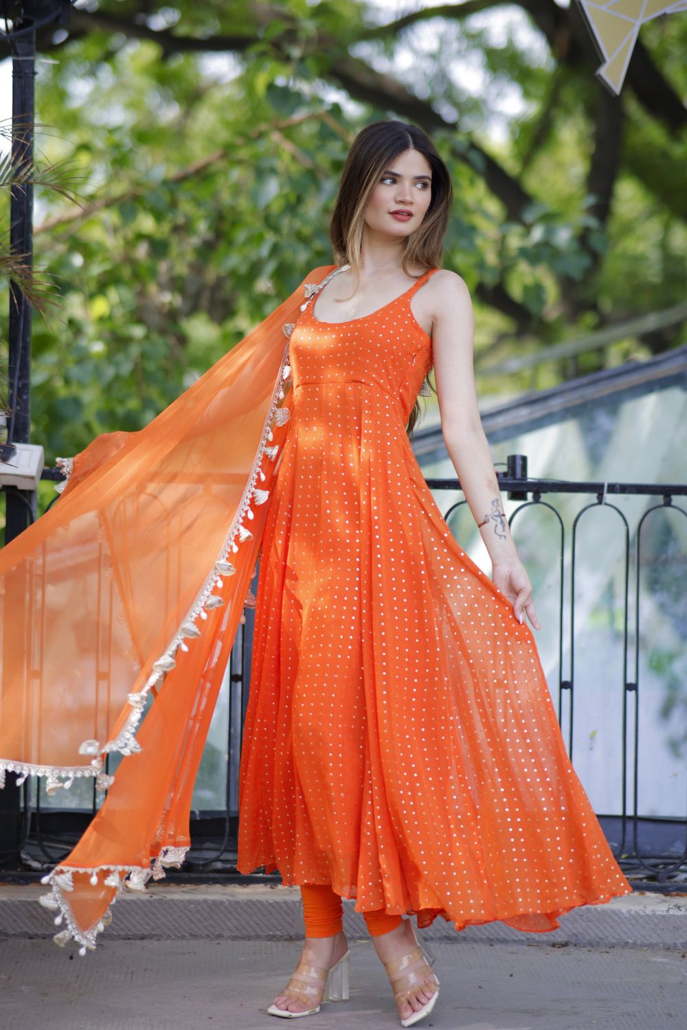 Dolly Orange Anarkali Suit by Imagine By Shiwali, featuring intricate embroidery and flowing fabric, traditional Indian attire.