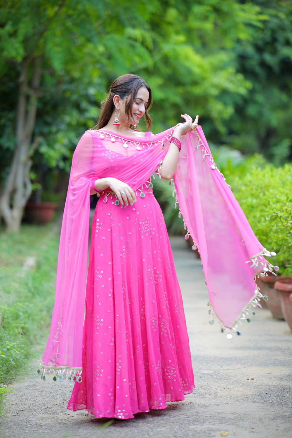 Pink Dolly Anarkali dress by Imagine By Shiwali, showcasing intricate embroidery and flowing fabric.