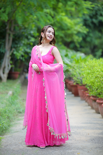 Pink Dolly Anarkali dress by Imagine By Shiwali featuring intricate embroidery and flowing fabric, perfect for traditional occasions.