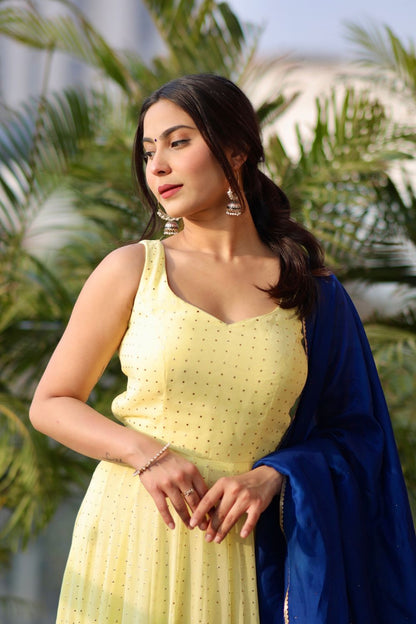 Yellow Madhubala Anarkali suit by Imagine By Shiwali featuring geoergette fabric and matching dupatta with shantoon lining.