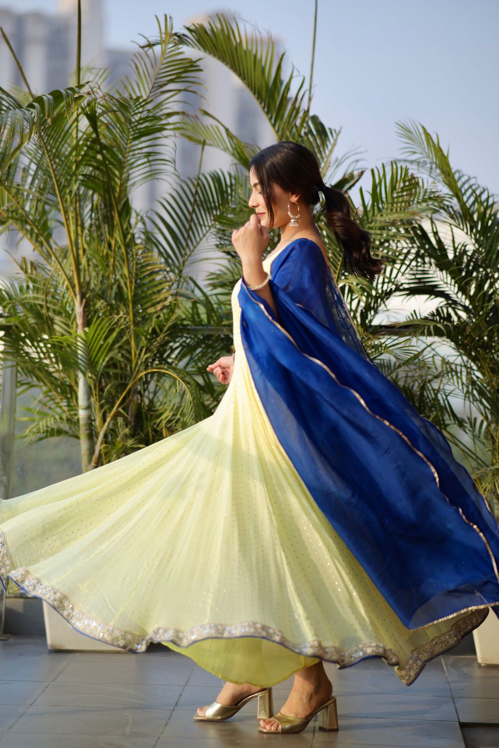 Yellow Madhubala Anarkali suit by Imagine By Shiwali with geoergette fabric and mulmul dupatta, styled with shantoon lining.