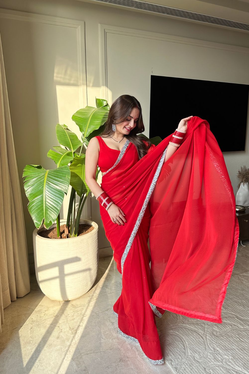 Raveena Georgette Saree with matching blouse by Imagine By Shiwali, featuring elegant drape and intricate fabric details.