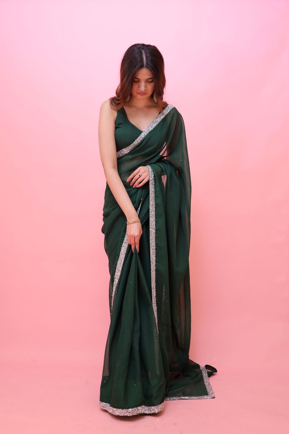 Raveena Georgette Saree with matching blouse by Imagine By Shiwali, showcasing intricate draping and elegant fabric details.