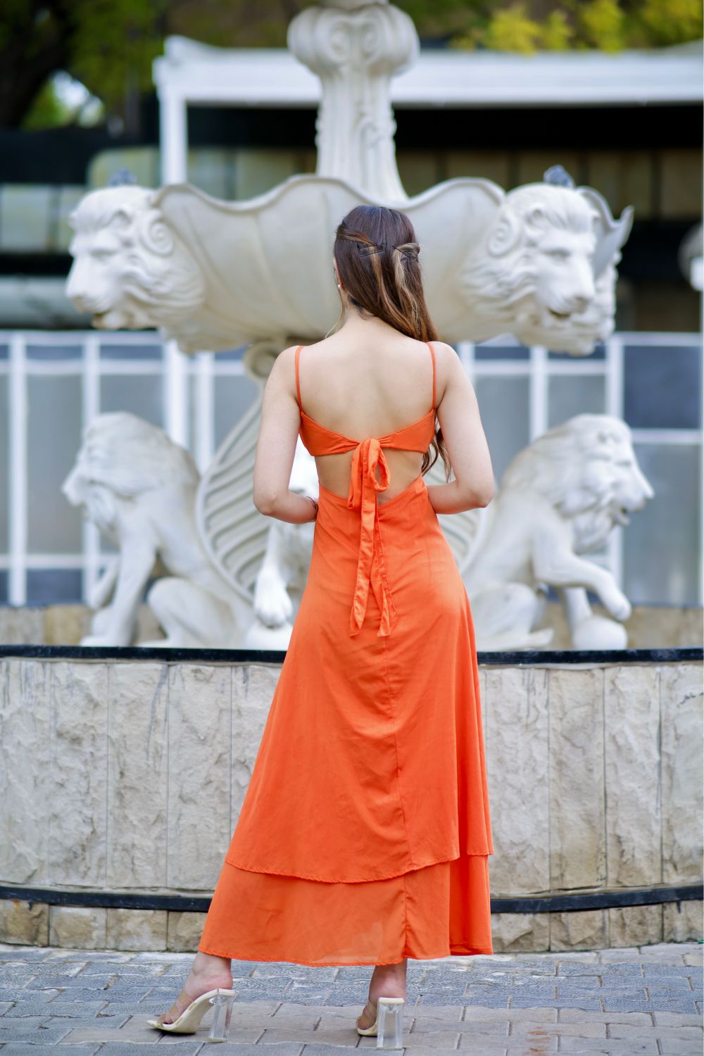 Orange Isabella Cutout Dress by Imagine By Shiwali, featuring stylish cutout details and a fitted silhouette on a model.