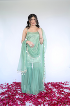 Imagine by Shiwali Keeva Green Sharara Set featuring a flowy green top with matching wide-leg sharara pants.
