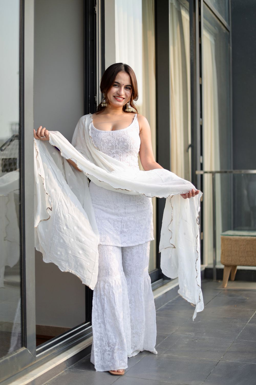 White Laila Chikankari Sharara Suit by Imagine By Shiwali with intricate embroidery and flowing fabric, traditional Indian attire.