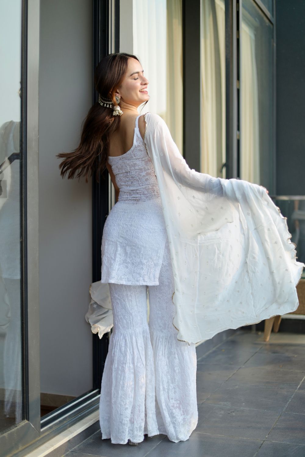 White Laila Chikankari Sharara Suit by Imagine By Shiwali, featuring intricate embroidery and traditional design.