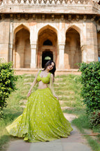 Lehra Lime Blossom Mirror Lehenga Set by Imagine By Shiwali featuring intricate mirror work and vibrant lime green fabric.