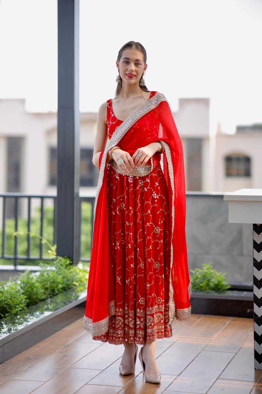 Red Maastani Anarkali dress by Imagine By Shiwali featuring intricate embroidery and flowing fabric.