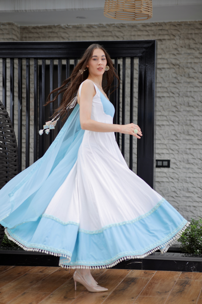 White and blue Meera Anarkali dress by Imagine by Shiwali featuring intricate embroidery and flowing fabric.