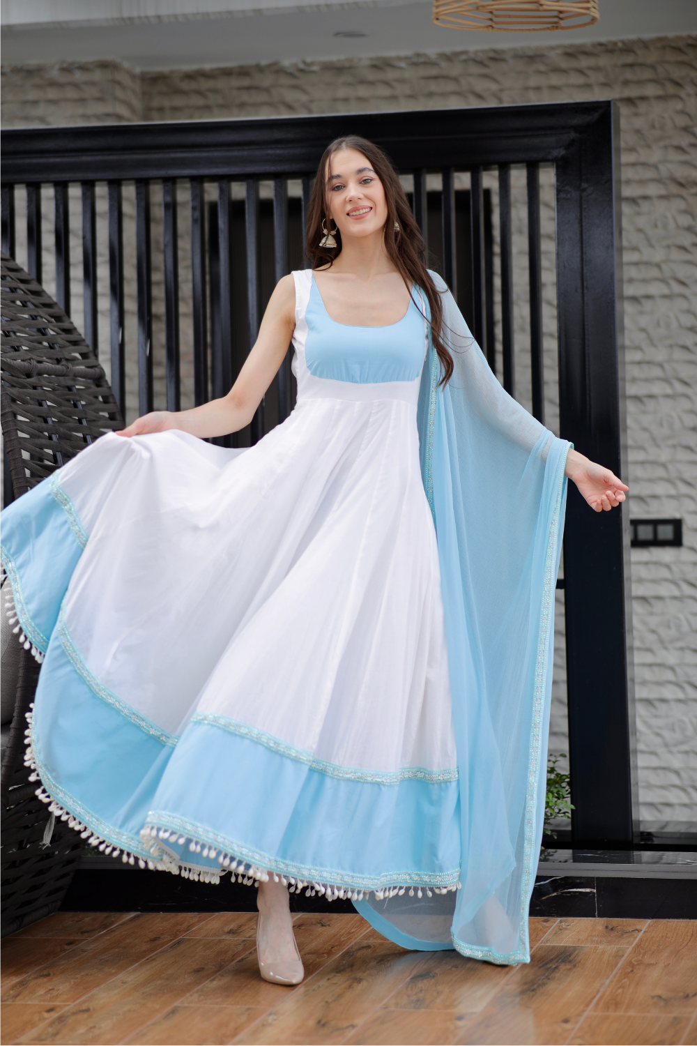 White and blue Meera Anarkali dress by Imagine By Shiwali, featuring intricate embroidery and flowing fabric.