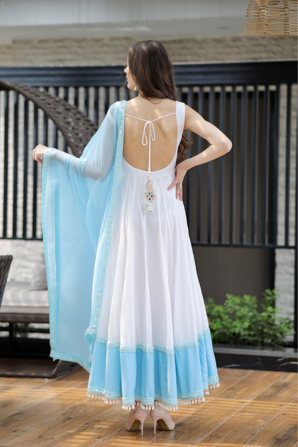 White and blue Meera Anarkali dress by Imagine By Shiwali, featuring intricate embroidery and flowing fabric.