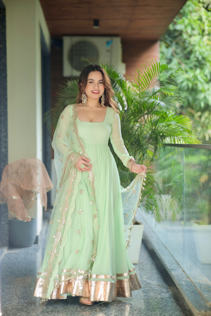 Imagine By Shiwali green Morni Anarkali dress with intricate embroidery and flowing fabric, shown in a full-length view.