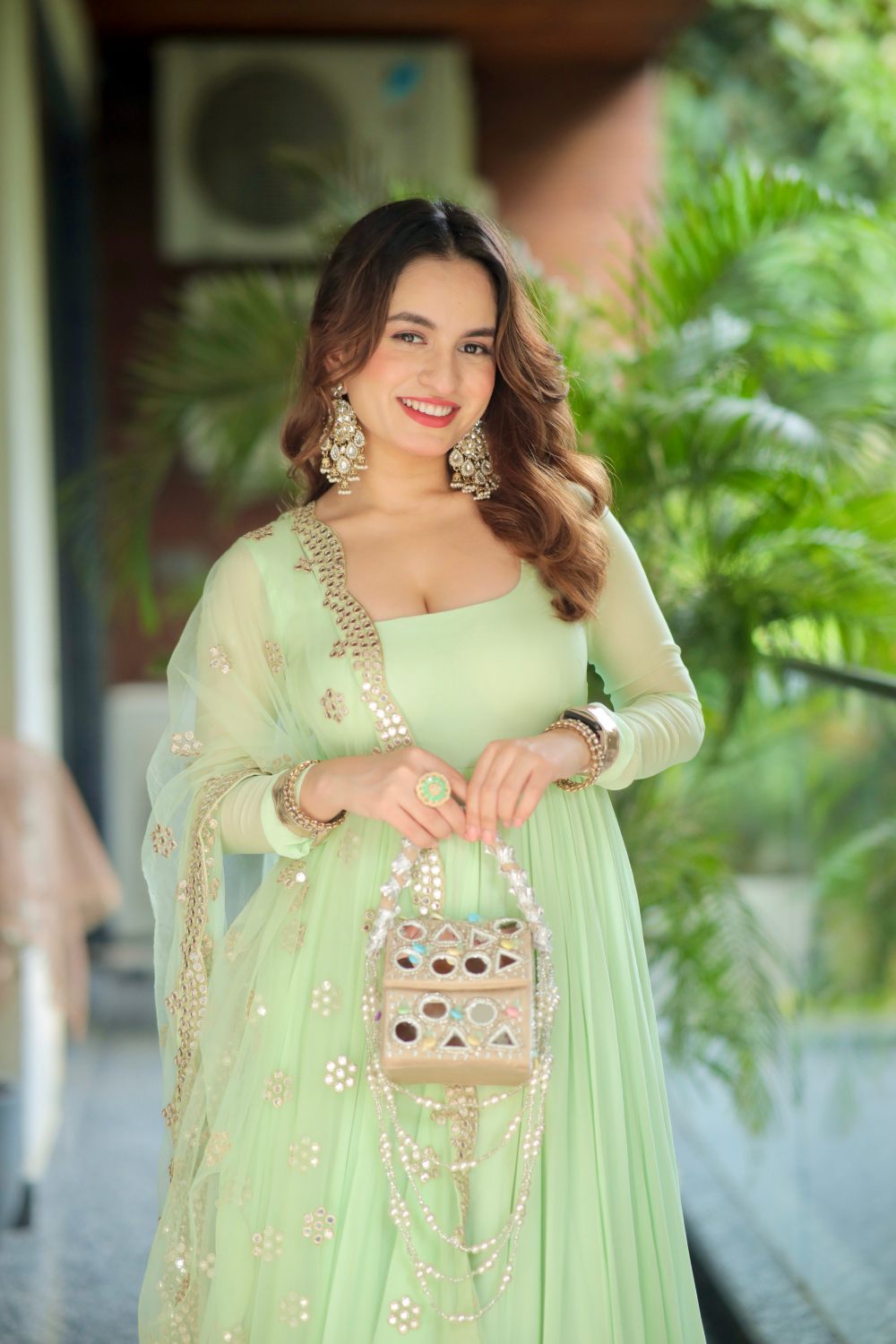 Imagine by Shiwali Morni green Anarkali with intricate embroidery and flowy fabric, displayed on a hanger.
