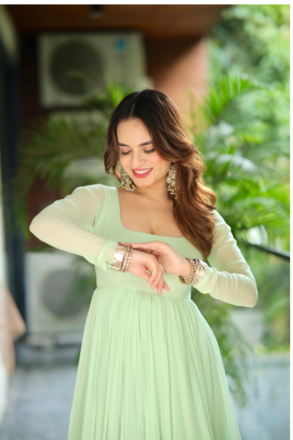 Green Morni Anarkali dress by Imagine By Shiwali featuring intricate embroidery and flowing fabric, displayed on a mannequin.