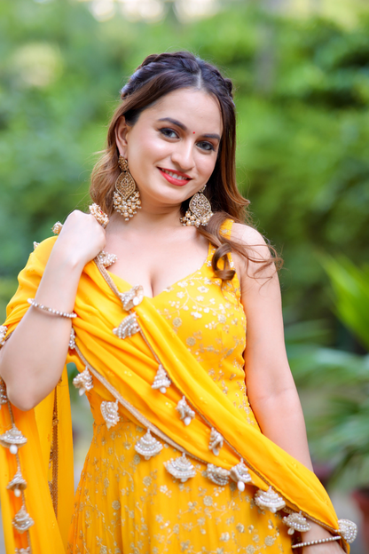Yellow Noor Anarkali dress with intricate Zari work by Imagine By Shiwali, featuring traditional embroidery and elegant design.