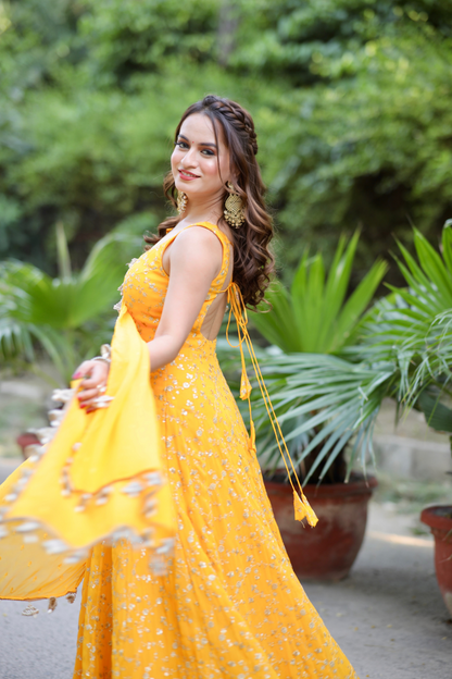 Yellow Noor Anarkali with Zari Work by Imagine By Shiwali, showcasing intricate embroidery and flowing fabric.