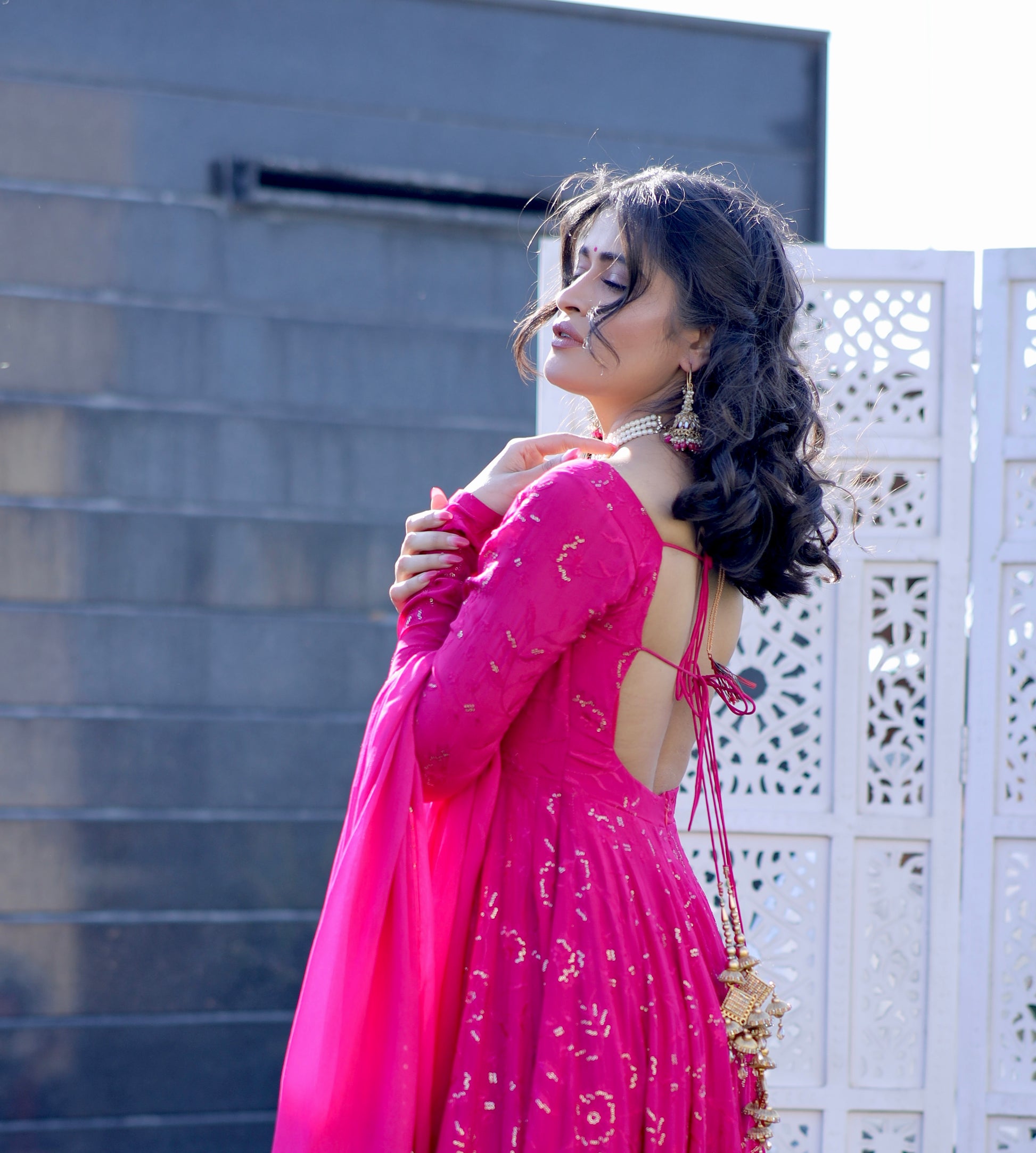 Hot pink Nurvi Anarkali suit with matching plazo pants by Imagine By Shiwali, showcasing intricate embroidery and flowy fabric.