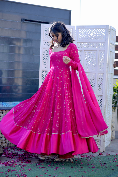 Hot pink Nurvi Anarkali suit with plazo pants by Imagine By Shiwali, featuring intricate embroidery and flowing fabric.