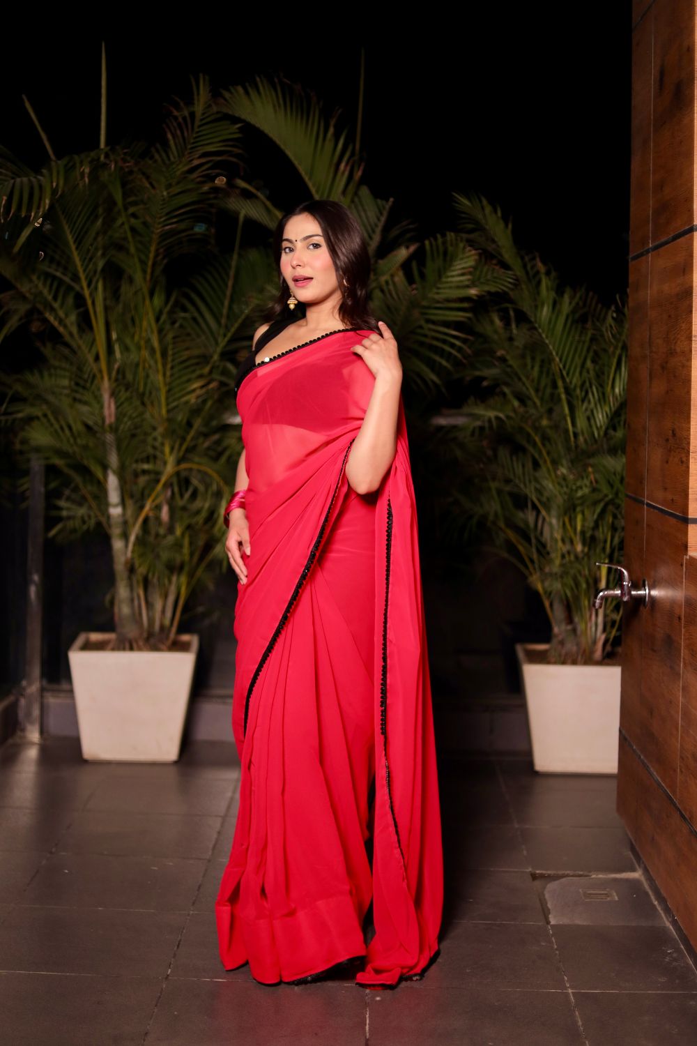 Raveena Georgette saree with matching blouse from Imagine By Shiwali, featuring intricate draping and elegant fabric details.