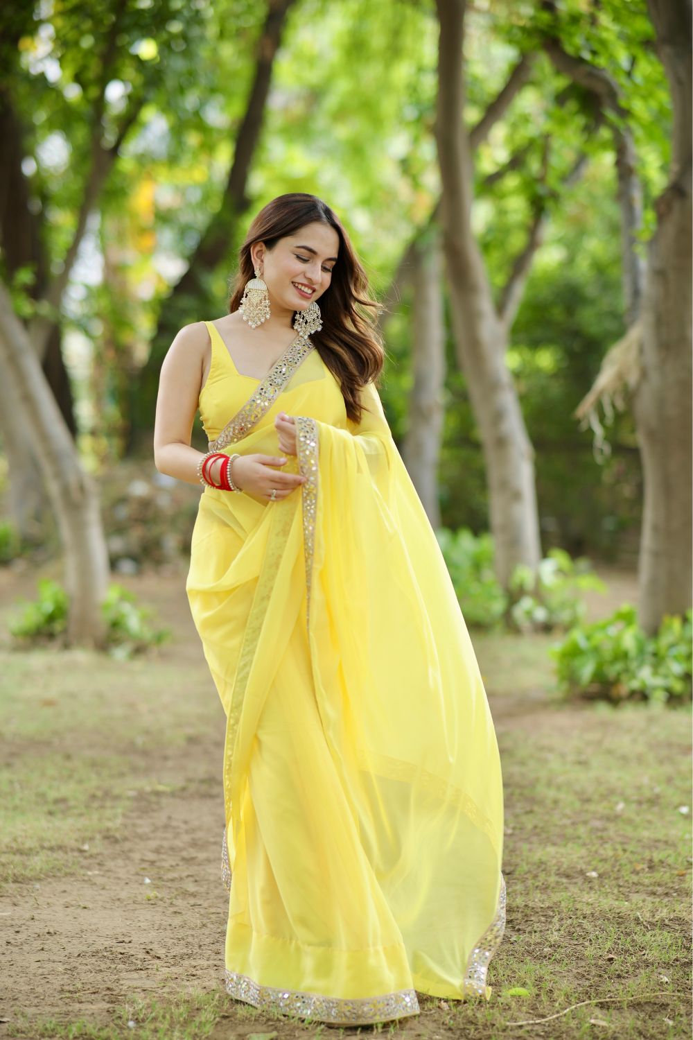 About Raveena Georgette Yellow Saree with Blouse