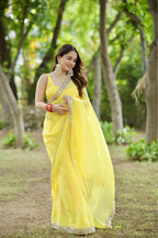 Yellow Raveena Georgette saree with matching blouse from Imagine By Shiwali, featuring intricate design and vibrant color.