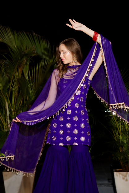 Purple Rekha Sharara Suit by Imagine By Shiwali featuring intricate embroidery and flowing fabric, styled for elegant traditional wear.