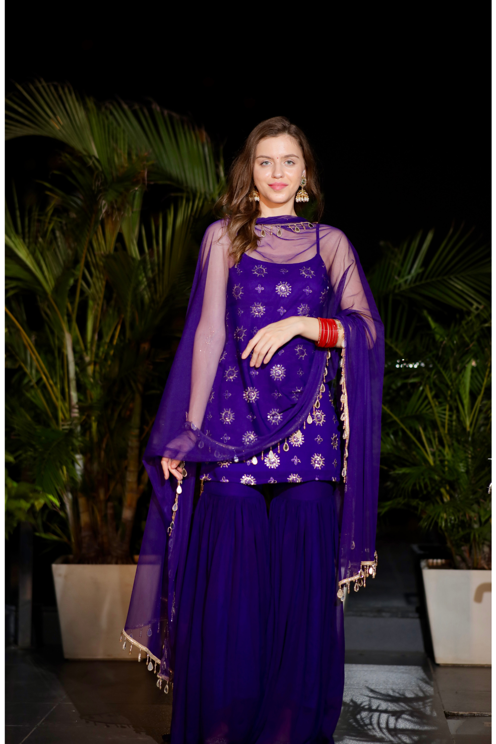 Imagine by Shiwali Rekha Purple Sharara Suit featuring a flowy purple top and matching wide-leg sharara pants.