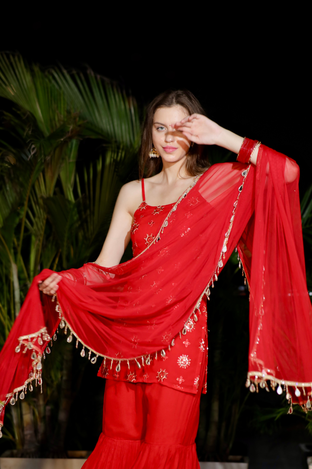Red Rekha Sharara set by Imagine By Shiwali featuring a flowy sharara and matching top, perfect for traditional festive occasions.