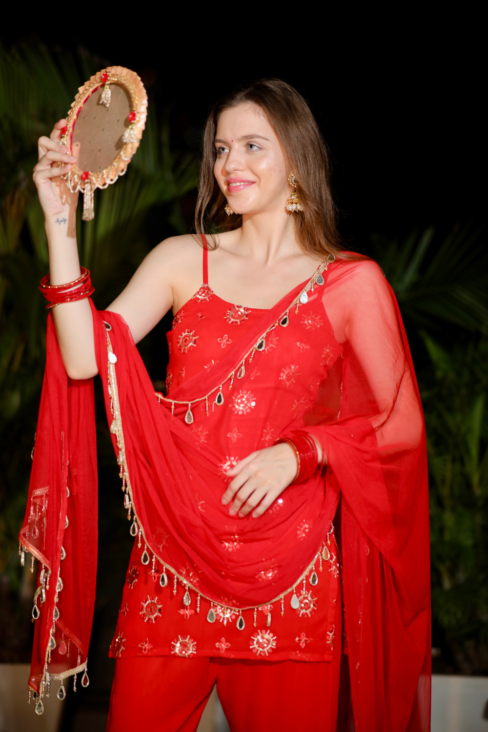 About Rekha Red Sharara set