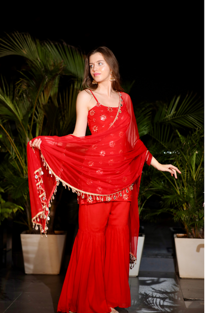 Red Sharara set with intricate embroidery from Imagine By Shiwali, featuring a matching top and wide-leg pants.