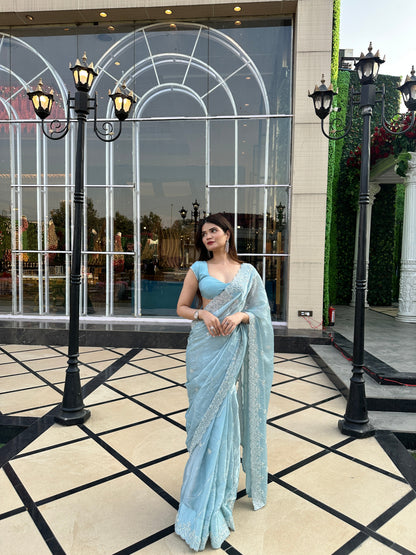 Blue Reva Saree by Imagine By Shiwali, featuring intricate traditional patterns and elegant drape in a vibrant blue color.