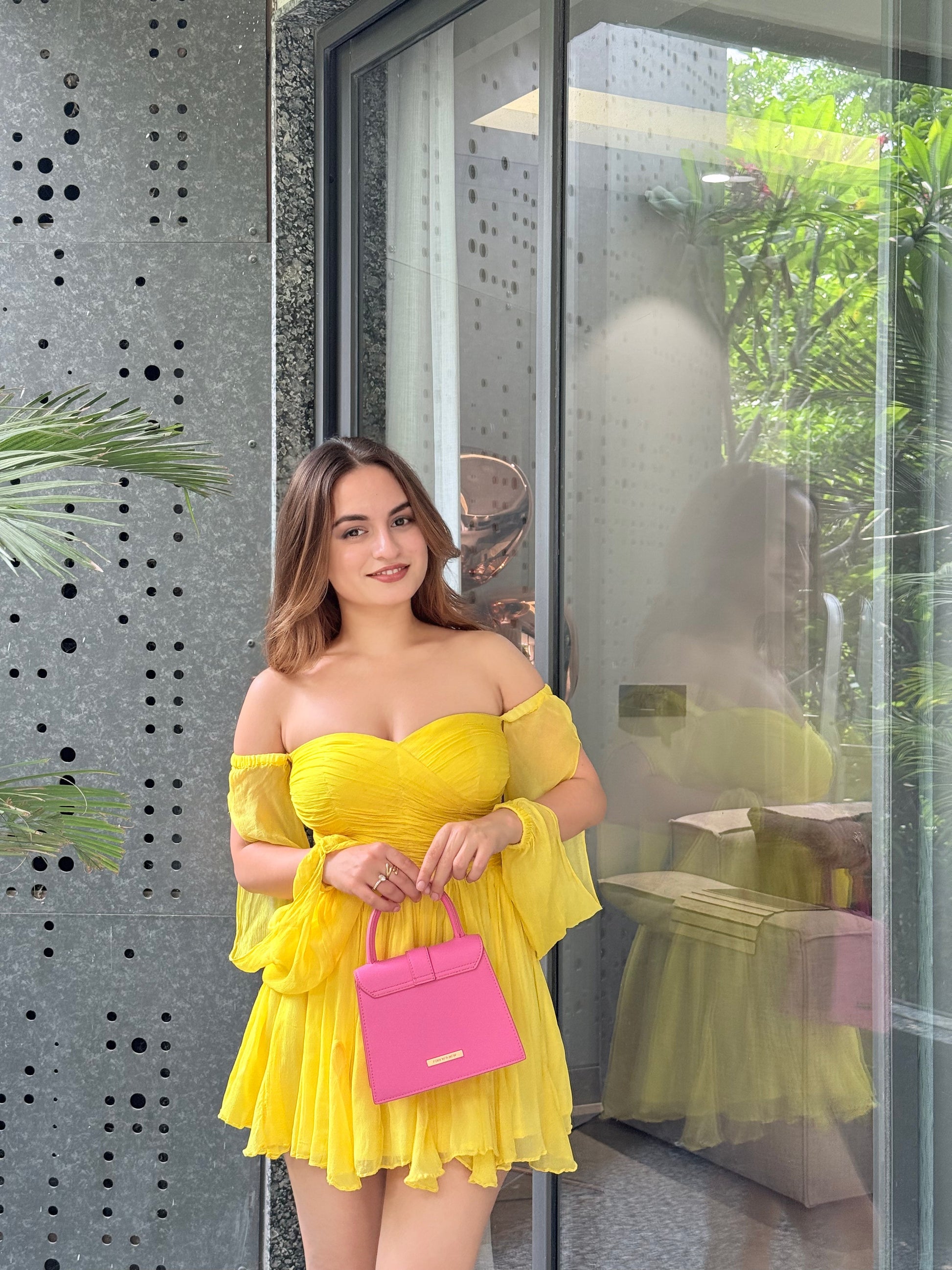 Yellow Rory dress by Imagine By Shiwali, featuring a stylish design and lightweight fabric, displayed on a hanger.