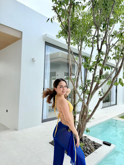 Sam yellow bikini top paired with navy blue pants from Imagine By Shiwali, styled for casual summer wear.