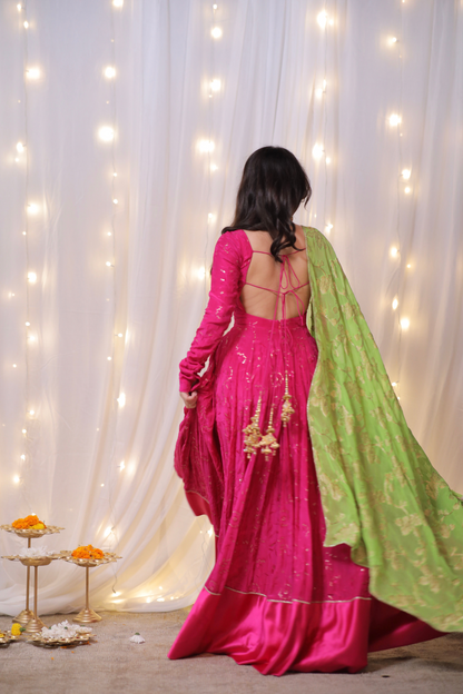 Fuchsia pink Sanvi Lehenga with embroidery, green dupatta, and matching potli bag from Imagine By Shiwali.