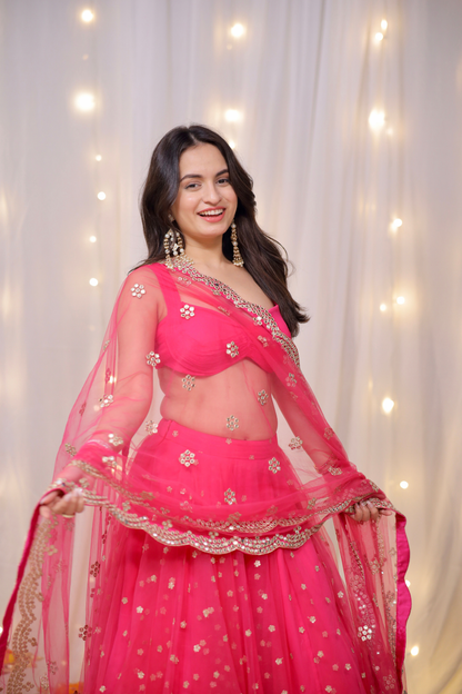 Sara Hot Pink Embellished Lehenga Set by Imagine By Shiwali, featuring intricate embellishments and traditional Indian bridal style.