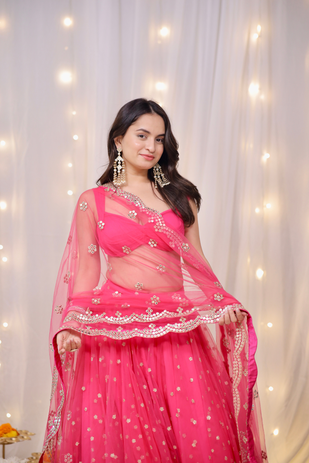 Hot pink embellished lehenga set by Imagine by Shiwali featuring intricate embroidery and traditional design.