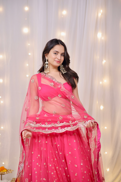 Hot pink embellished lehenga set by Imagine by Shiwali featuring intricate embroidery and traditional design.