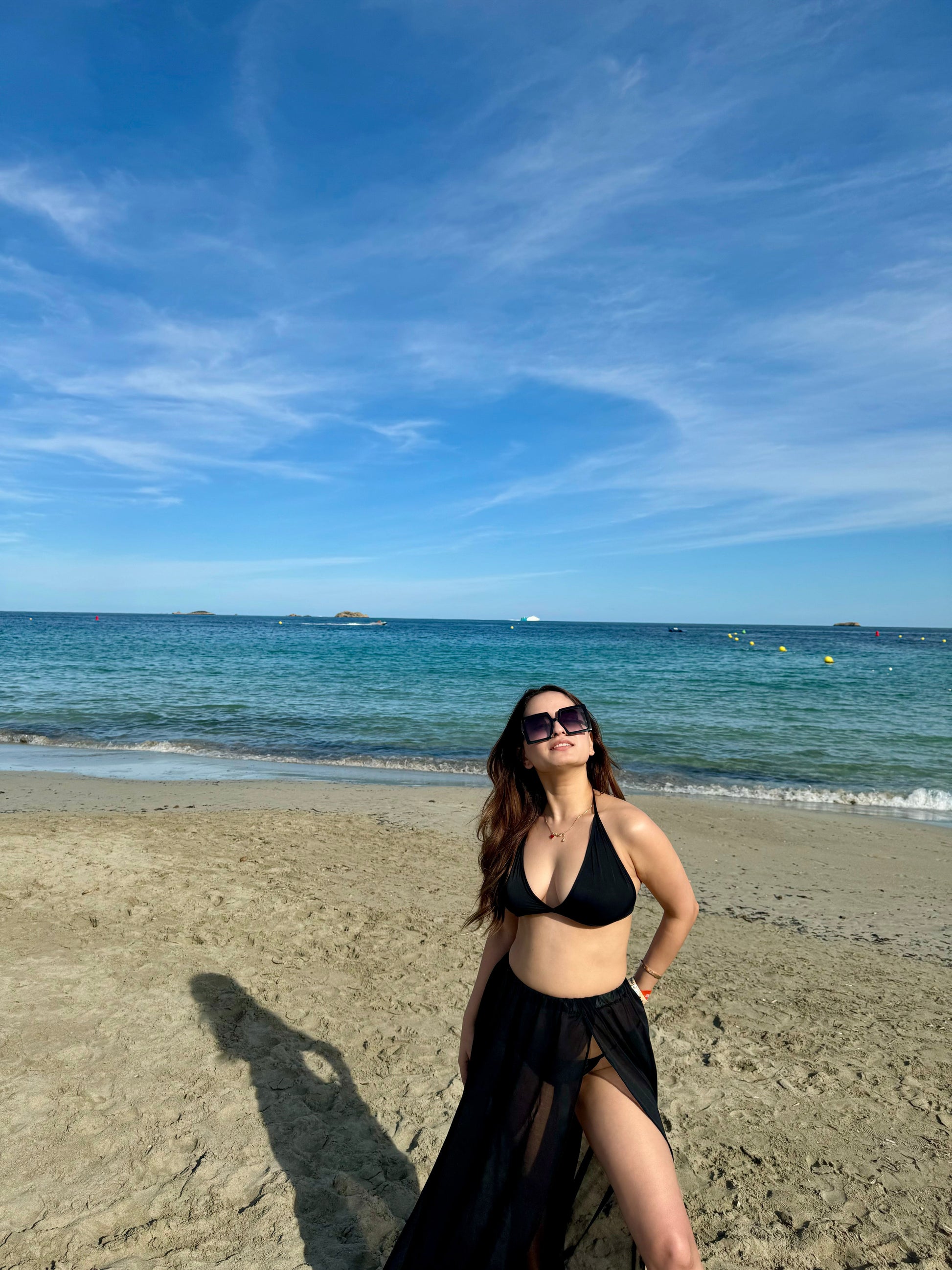 Scarlet black bikini set by Imagine By Shiwali featuring a triangle top and matching bottoms.