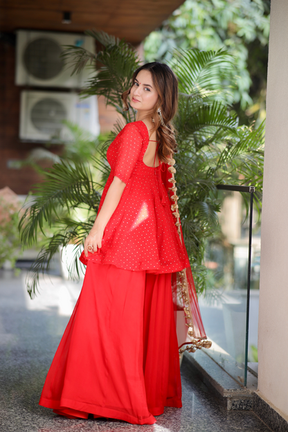 Red Suraiya peplum suit by Imagine By Shiwali, featuring traditional embroidery and a stylish fit, shown in the image.