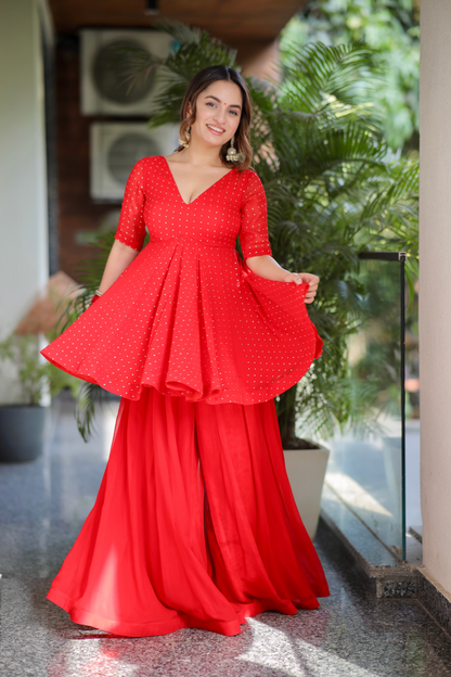 Red Suraiya peplum suit by Imagine By Shiwali, featuring a stylish peplum top and matching traditional bottom, detailed embroidery.