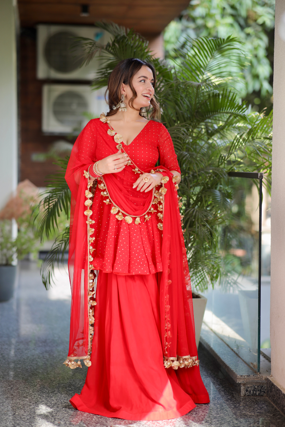 Red Suraiya peplum suit by Imagine By Shiwali featuring intricate embroidery and a stylish, traditional design.