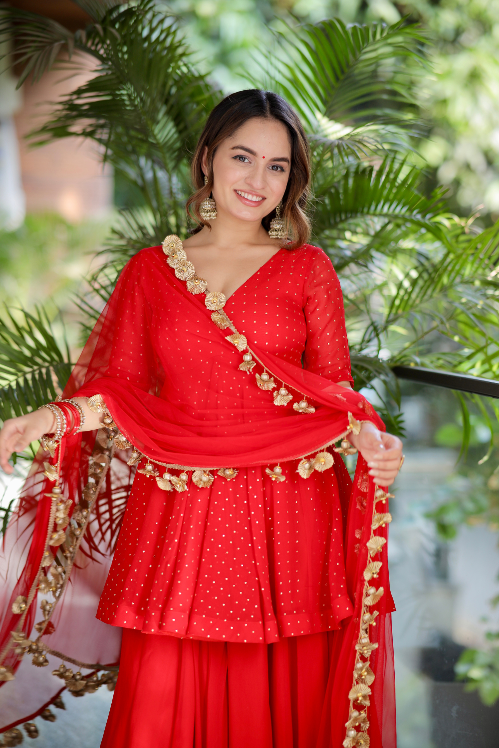 Red Suraiya peplum suit by Imagine By Shiwali featuring a fitted waist, intricate embroidery, and traditional Indian design.