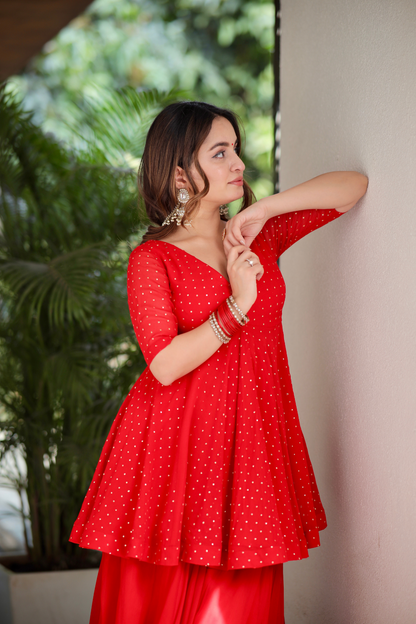 Red Suraiya peplum suit by Imagine By Shiwali, featuring intricate embroidery and a stylish peplum design.
